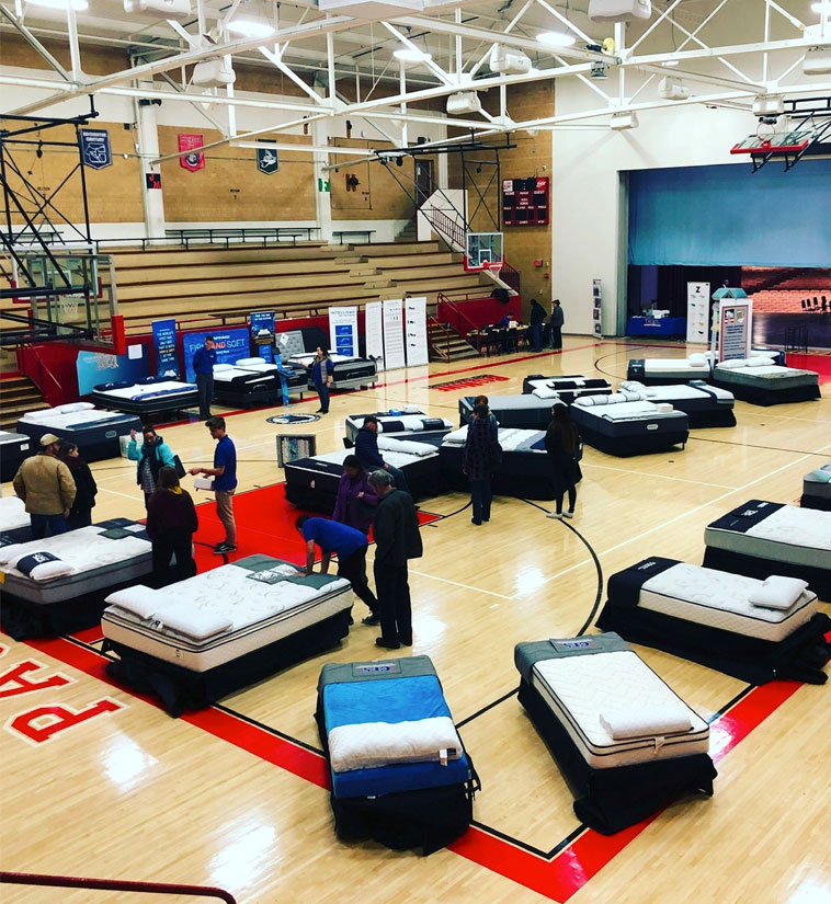 Mattresses on Display at a School Gym