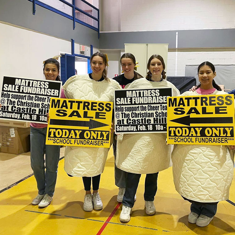 Group of Friends Showcasing a Mattress Sale