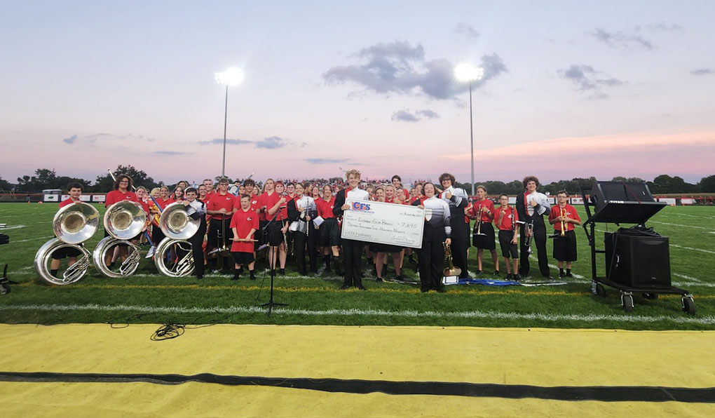 Group of People Showcasing a Mattress Fundraiser Cheque